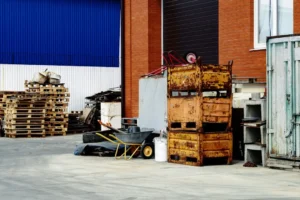 a pile of wooden crates sitting next to a building