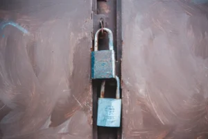 black and silver padlock on white plastic